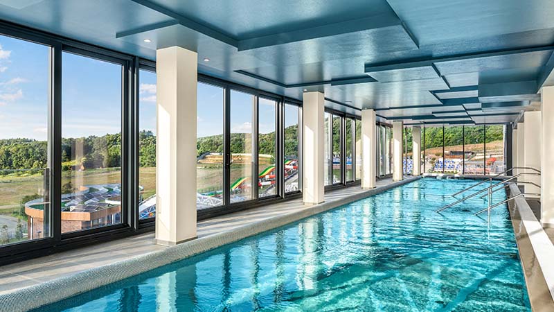 Swimming pool with panoramic windows overlooking the city